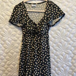 Urban outfitters black w/ yellow floral pattern romper size S preowned excellent